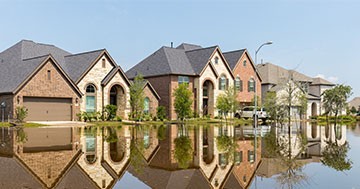 homes on a flooded street